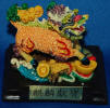 colorful kirin with kanji/chinese characters on plaque
